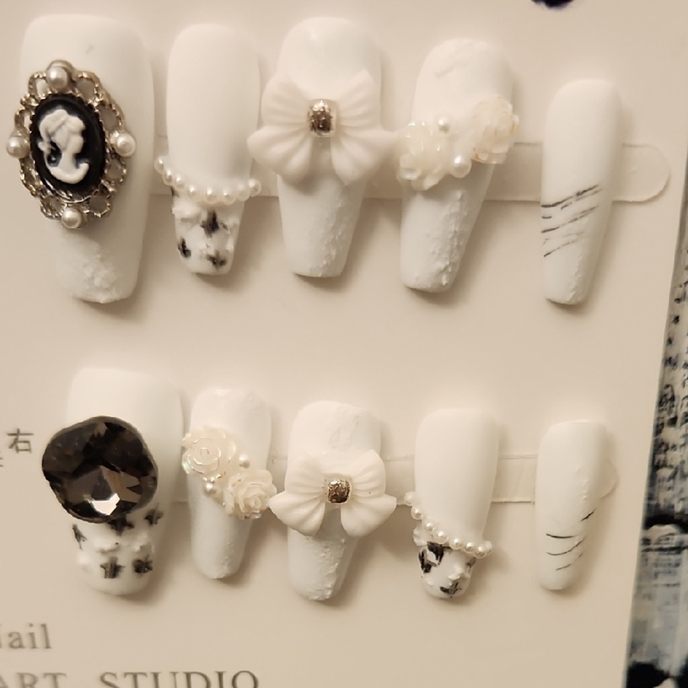 Elegant White Press-On Nails with Decorative Accents
